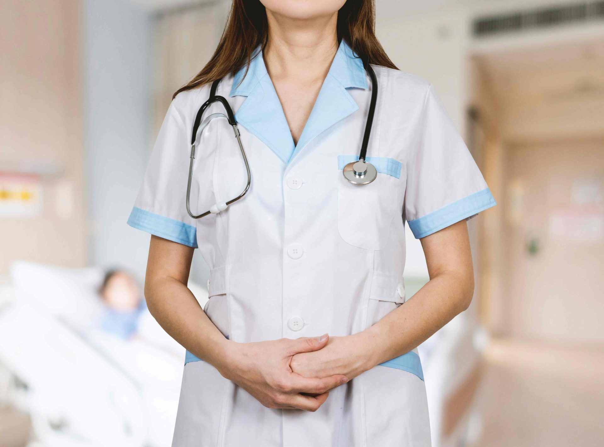 Nurse with stethoscope in hospital setting